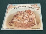 une image représentant un livre sur lequel figurent un chien et plusieurs chatons