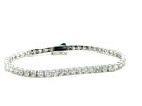 a diamond tennis bracelet on a white background