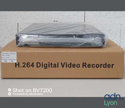 packaging for a digital video recorder sitting on top of a cardboard box