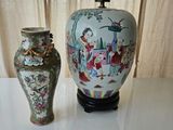 two vases sitting on a table next to each other