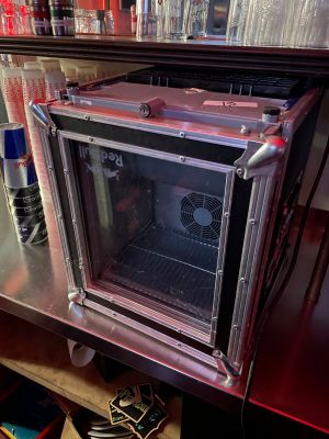 a small oven sitting on a table in a room