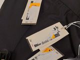 a suitcase with luggage tags on it sitting on a table