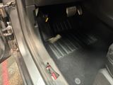 a close up of a car ' s interior with the door open
