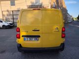 a yellow van that is parked in a parking lot