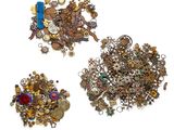 three different types of jewelry are displayed on a white surface