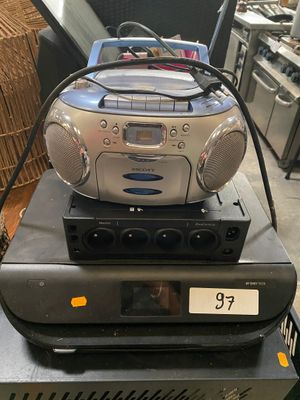 a radio that is sitting on top of a stack of electronics