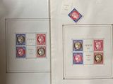three stamps on a table with a picture of a woman and a man on them