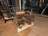 a glass display case with a lot of items in it