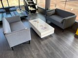 two couches, a coffee table, and a coffee table in a living room