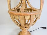 a wooden lamp that is sitting on a table