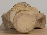 a wooden sculpture of a lion sitting on top of a box