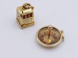 a small gold plated clock and a small gold plated clock
