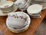 a lot of plates and cups on the table