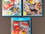 three nintendo wii games are sitting on a table