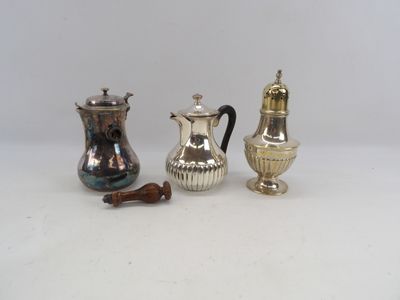 three silver coffee pots sitting next to each other on a table