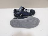 pair of blue and grey sneakers with white laces on a white surface