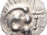 une image représentant une pièce d'argent sur laquelle figure le portrait d'un homme