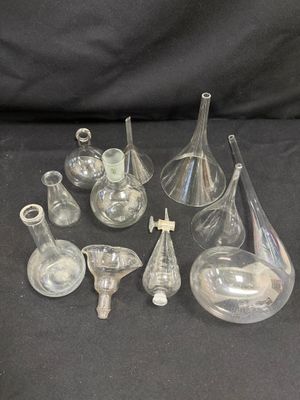 a lot of glass vases that are on a table