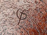 a drawing of a hammer and sick face on the ground