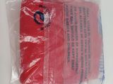 a plastic bag with a red object inside of it