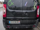 a van with graffiti on the side of it parked on the side of the road