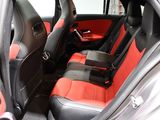 the interior of a car with red and black seats and a steering wheel