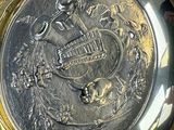 a gold plate with a picture of a horse on it
