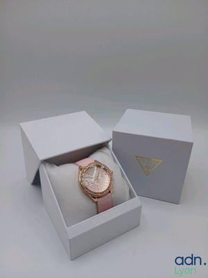 a close up of a box with a watch inside of it