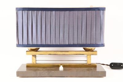 a lamp that is on top of a wooden stand
