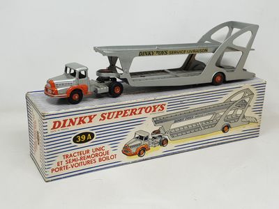 a box with a toy truck and a semi truck in it