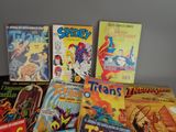 a lot of comic books that are on the table