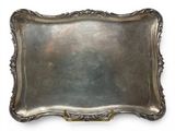 a silver tray with a handle on a white background
