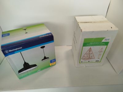 two boxes that are sitting on a shelf next to each other