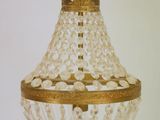 a gold chandelier hanging from a ceiling