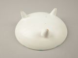 a small white object with horns on the top of it
