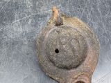 an old rusted metal object on a metal surface
