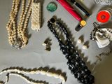 many different types of jewelry laid out on a table