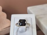 a ring that is sitting in a box on a table