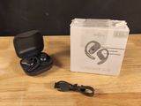 an open box with a pair of earphones sitting on top of a wooden table