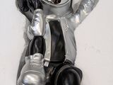 a statue of a man in a space suit sitting on a toilet