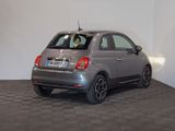 a small car that is parked in a room