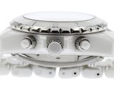 a close up of a watch on a white surface