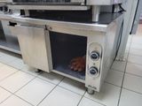 two hot dogs cooking in the oven on the counter