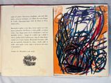 an open book with a picture of a drawing on it
