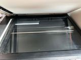 a person opening an open oven door to see what is inside