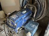a blue machine that is sitting in the corner of a room