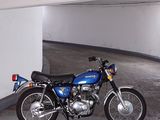 a blue motorcycle parked in a parking garage