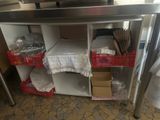 a kitchen counter with a bunch of items on top of it