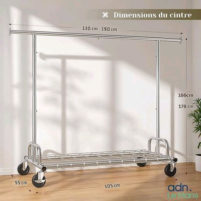 a metal rack with wheels and a plant in a room