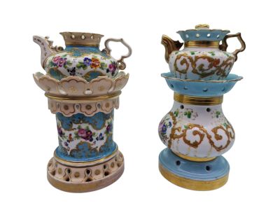 two vases sitting side by side on a white surface